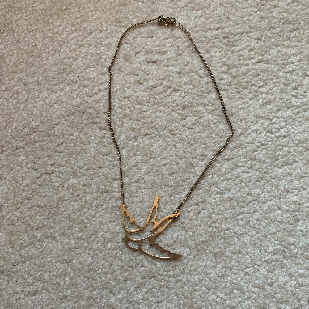 Gold bird necklace